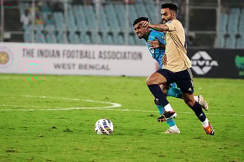 India’s Brandon Fernandes vies for the ball